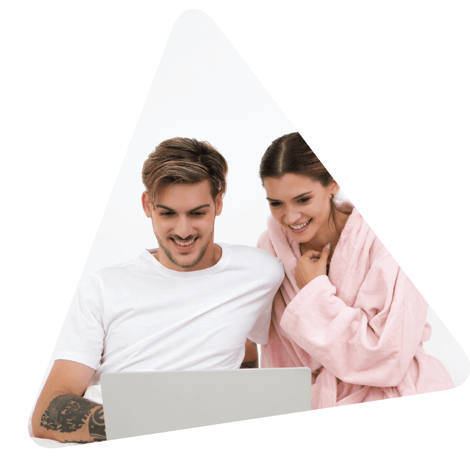 A young couple reading about first time home buyer tips on their Laptop with a triangular mask and transparent background
