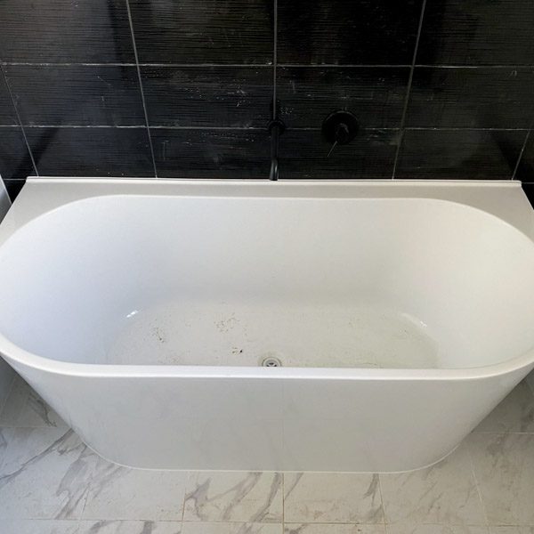 Semi free standing bath in a Move Homes ensuite in Midvale