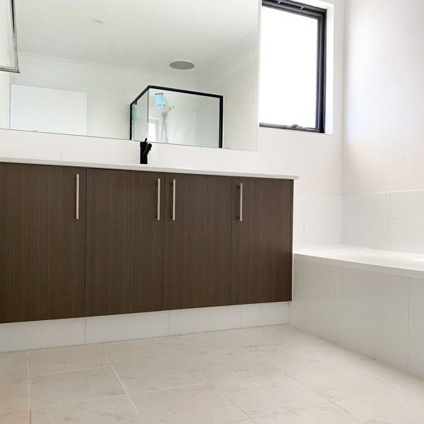 Cabinetry in bathroom by Move Homes in a Silver Riftwood colour
