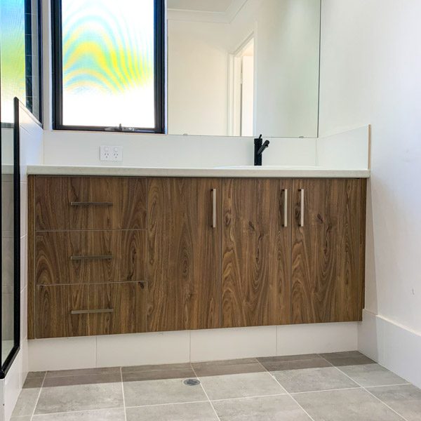 Ensuite cabinetry by Move Homes in Natural Walnut