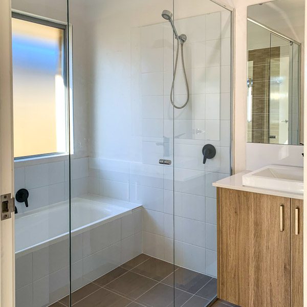 The bathroom with a hobless shower during the practical completion inspection