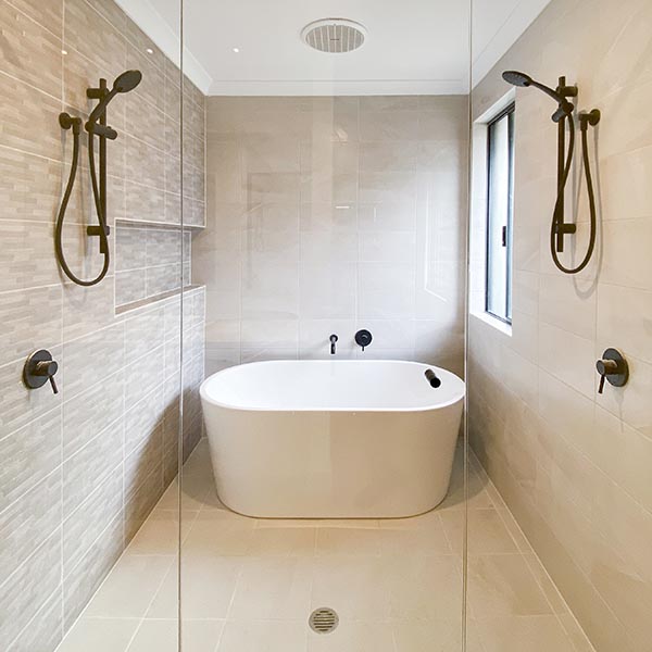Custom ensuite with double showers and free standing bath