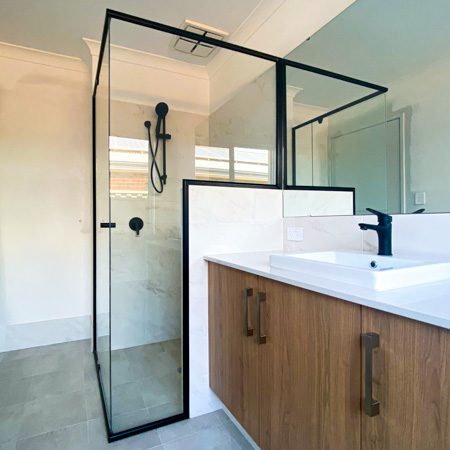 Tassie Oak cabinetry in an ensuite by Move Homes