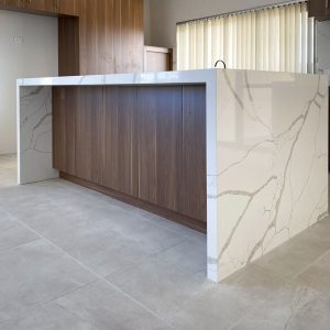 The Natale Wanut cabinetry with a waterfall edge by Move Homes